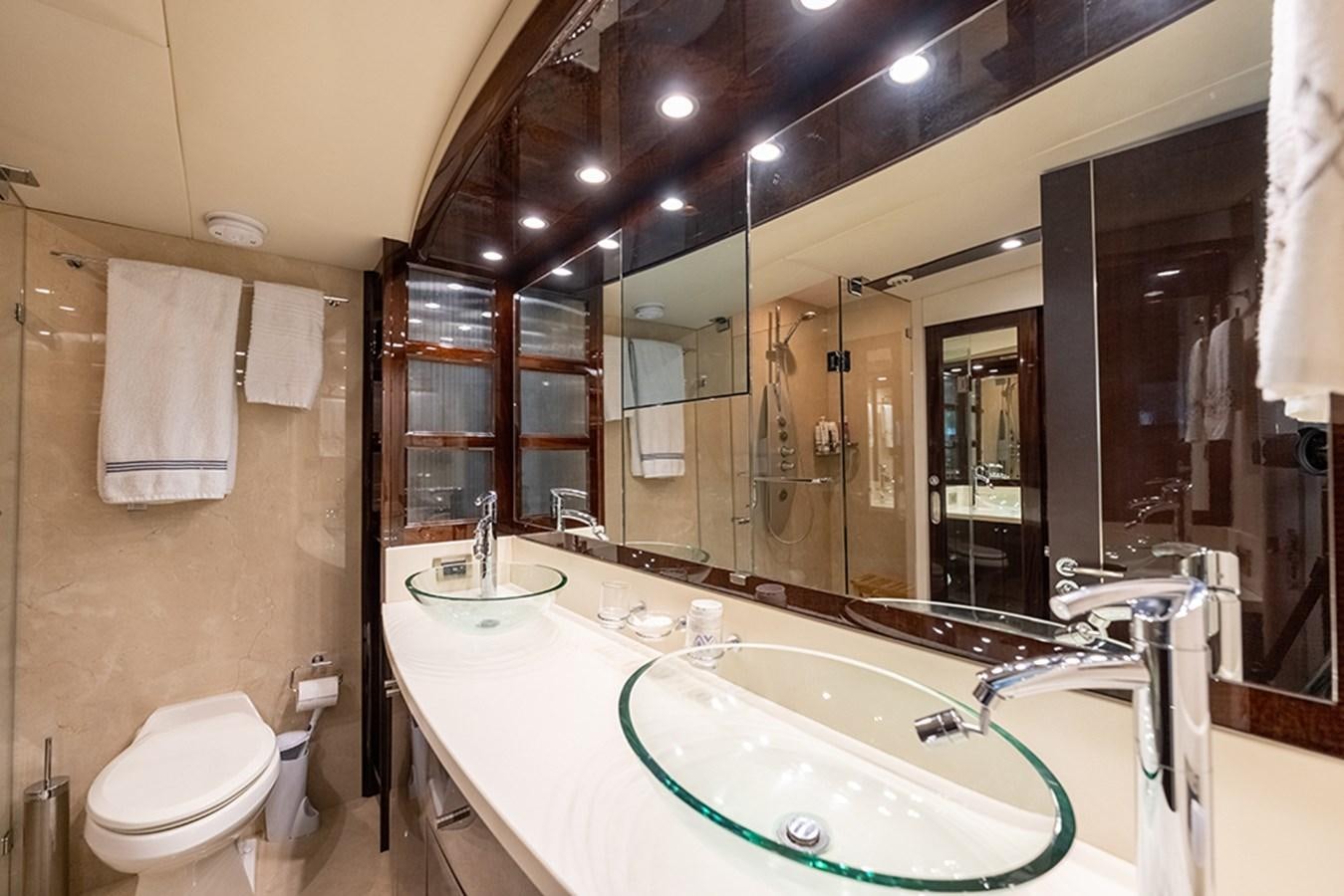 a bathroom with a large mirror aboard LATITUDE Yacht for Sale