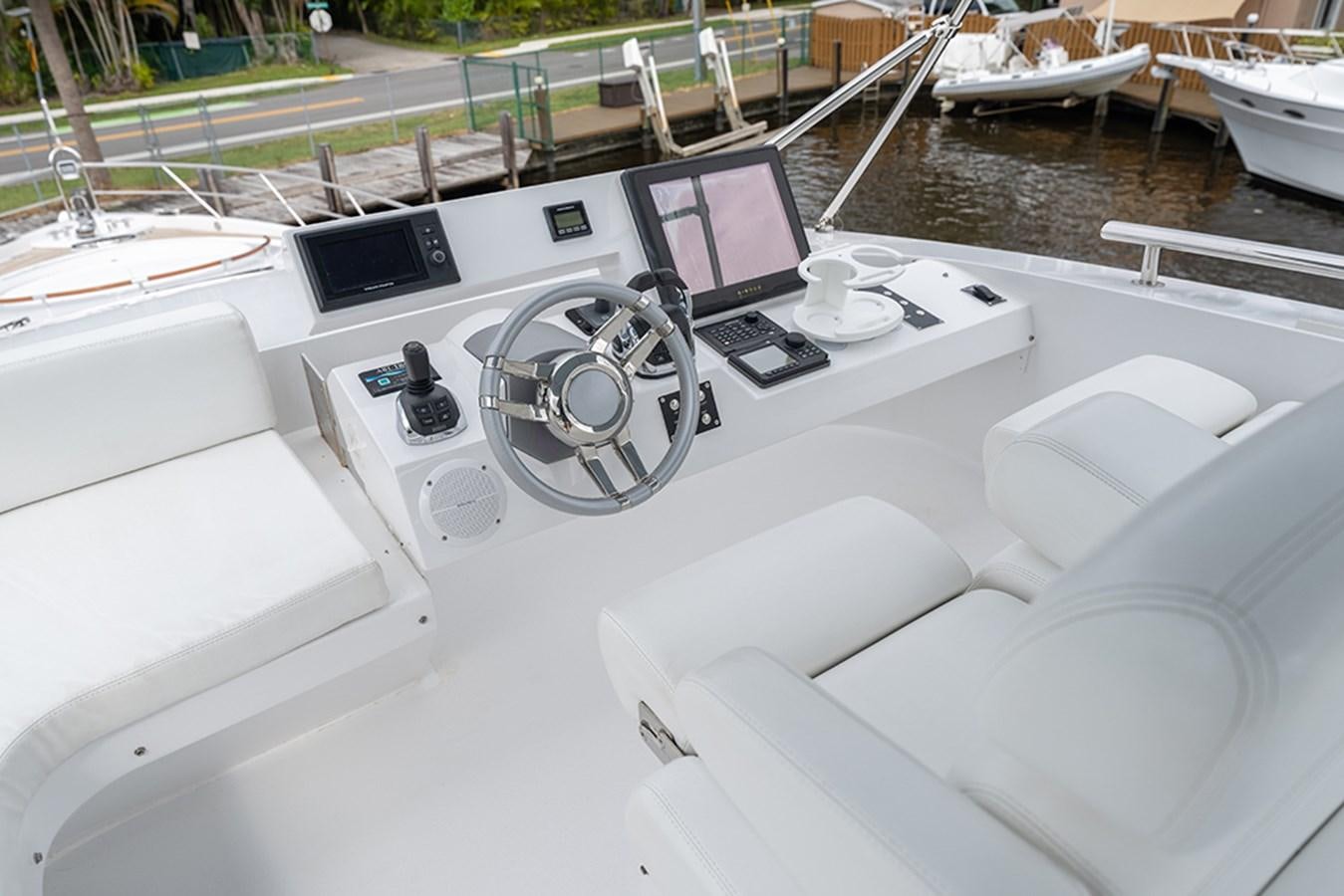 a white car with a screen aboard LATITUDE Yacht for Sale