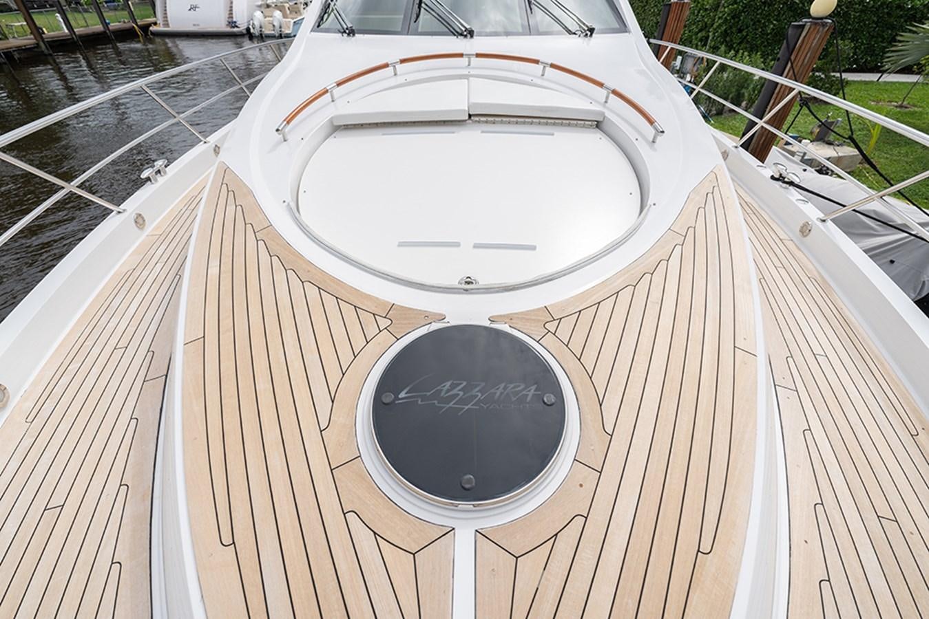 a white circular object on a wooden deck aboard LATITUDE Yacht for Sale