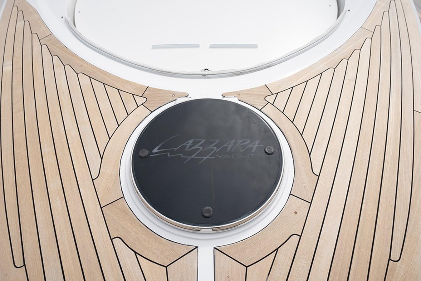 a black record player aboard LATITUDE Yacht for Sale