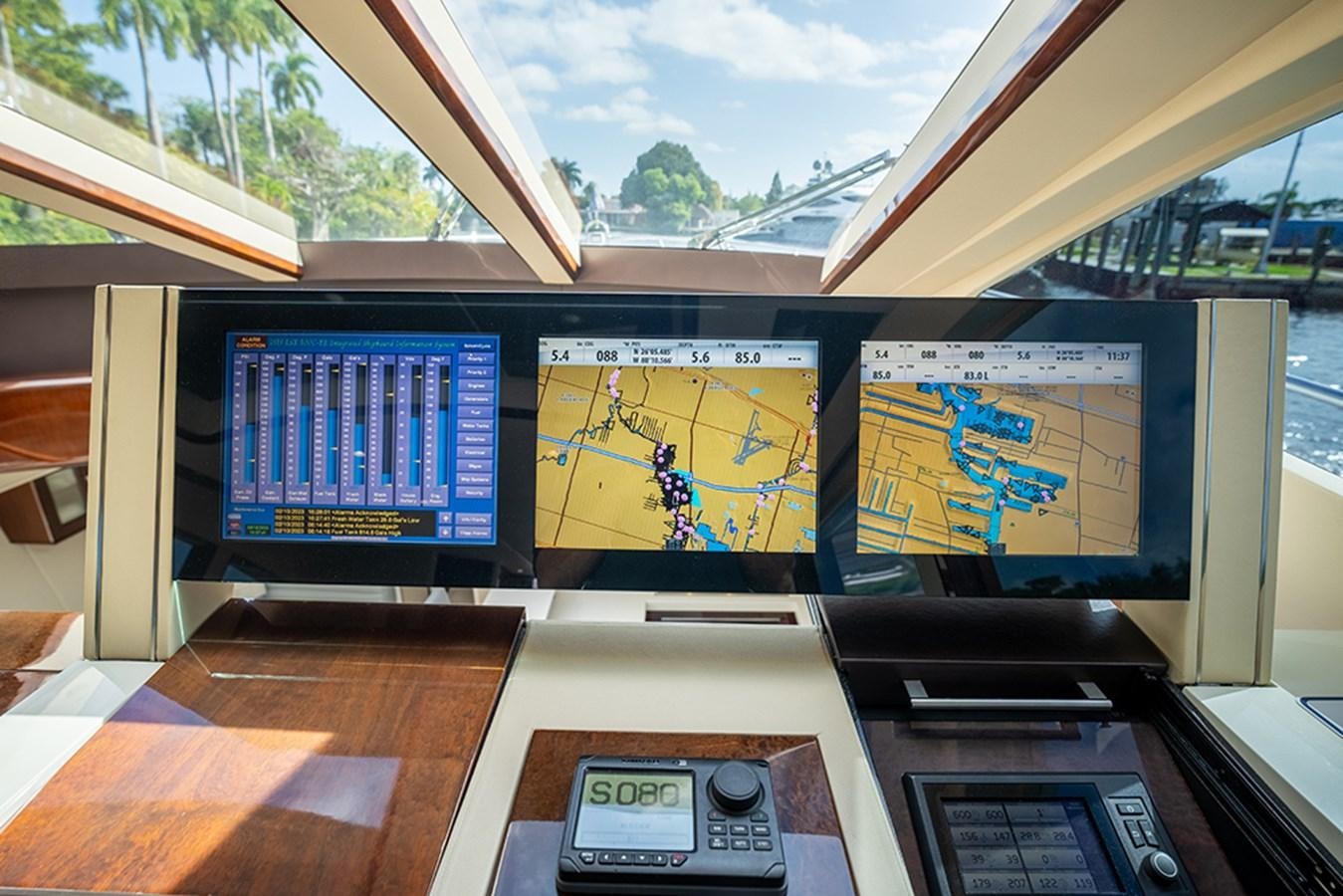 a group of monitors on a table aboard LATITUDE Yacht for Sale