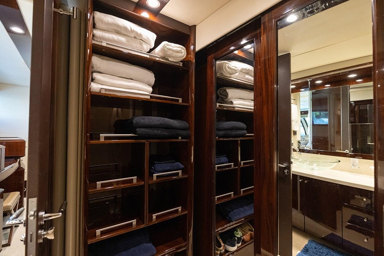 a closet full of folded towels aboard LATITUDE Yacht for Sale