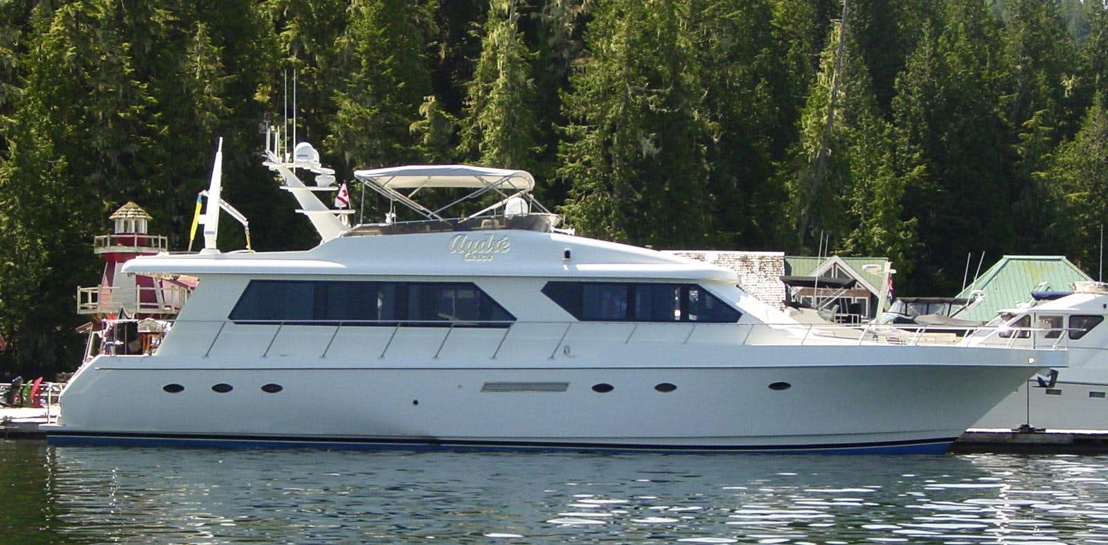 a large white boat in a body of water aboard AUDRE GRACE Yacht for Sale