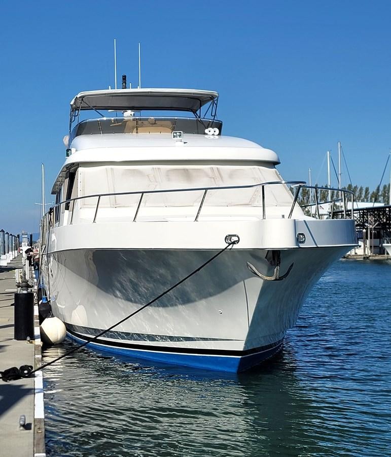 a large white boat in a harbor aboard AUDRE GRACE Yacht for Sale