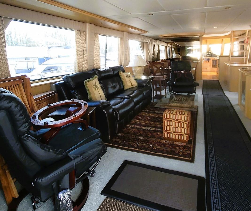 a living room with a leather couch and a rug aboard AUDRE GRACE Yacht for Sale