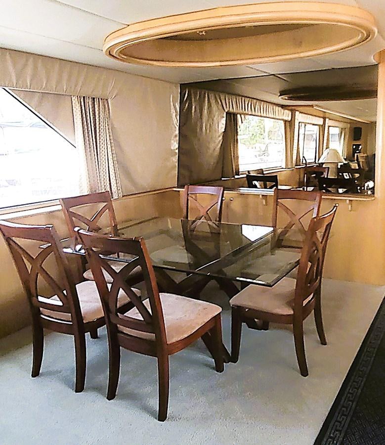 a dining room with chairs and a table aboard AUDRE GRACE Yacht for Sale