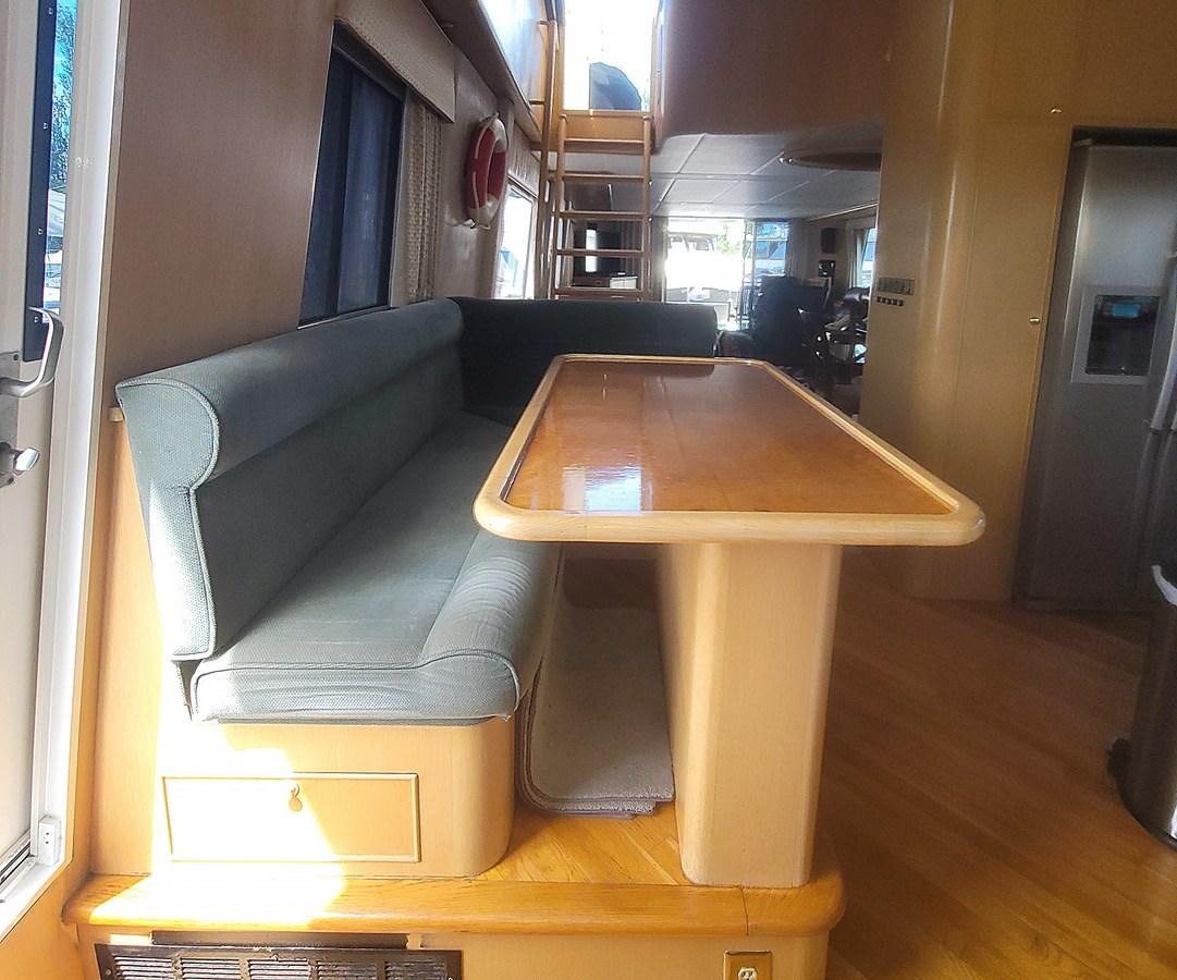 a couch and a table in a room aboard AUDRE GRACE Yacht for Sale