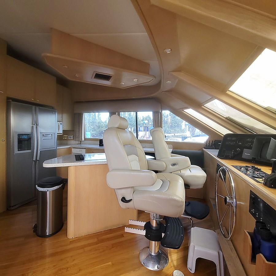 a room with a desk and chairs aboard AUDRE GRACE Yacht for Sale