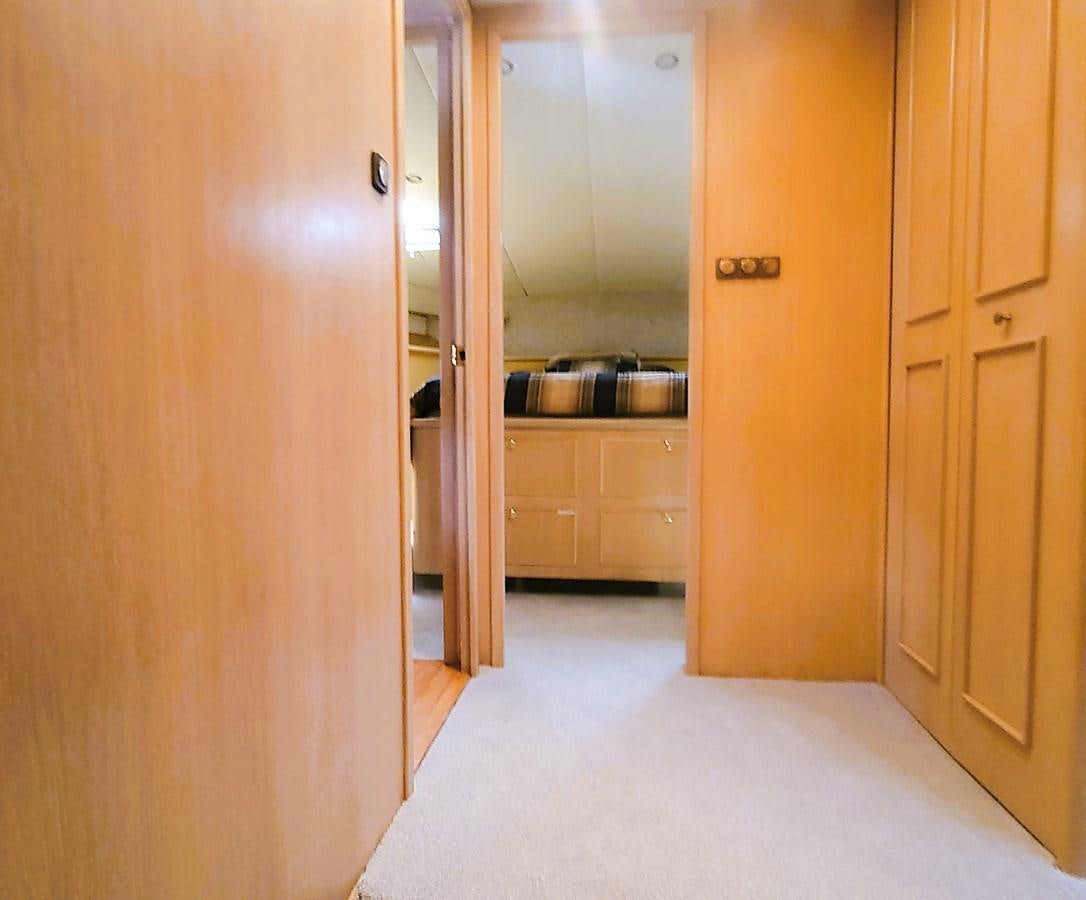 a room with a closet and a door aboard AUDRE GRACE Yacht for Sale