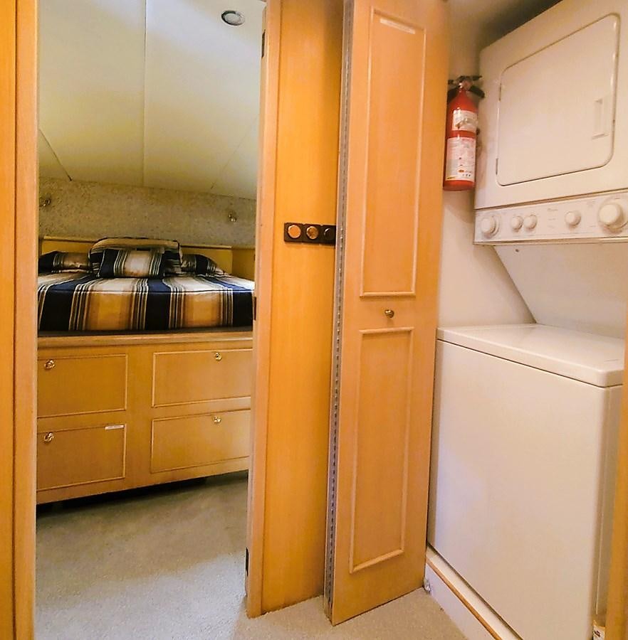 a kitchen with yellow cabinets aboard AUDRE GRACE Yacht for Sale