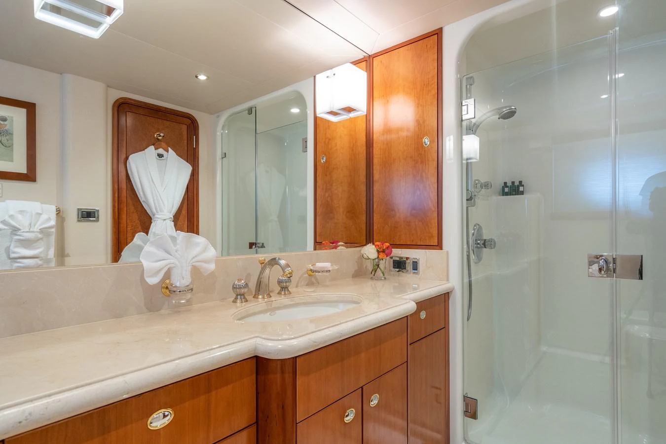 a bathroom with a glass shower aboard DONA LOLA Yacht for Sale