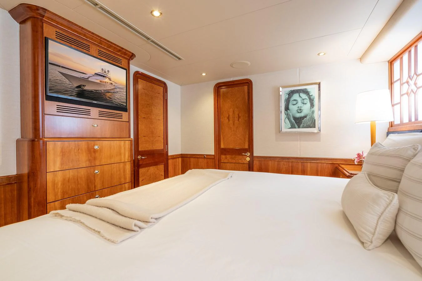 a bed in a room aboard DONA LOLA Yacht for Sale
