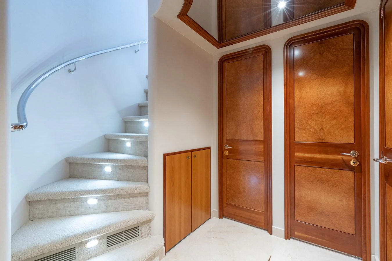 a room with wooden doors aboard DONA LOLA Yacht for Sale
