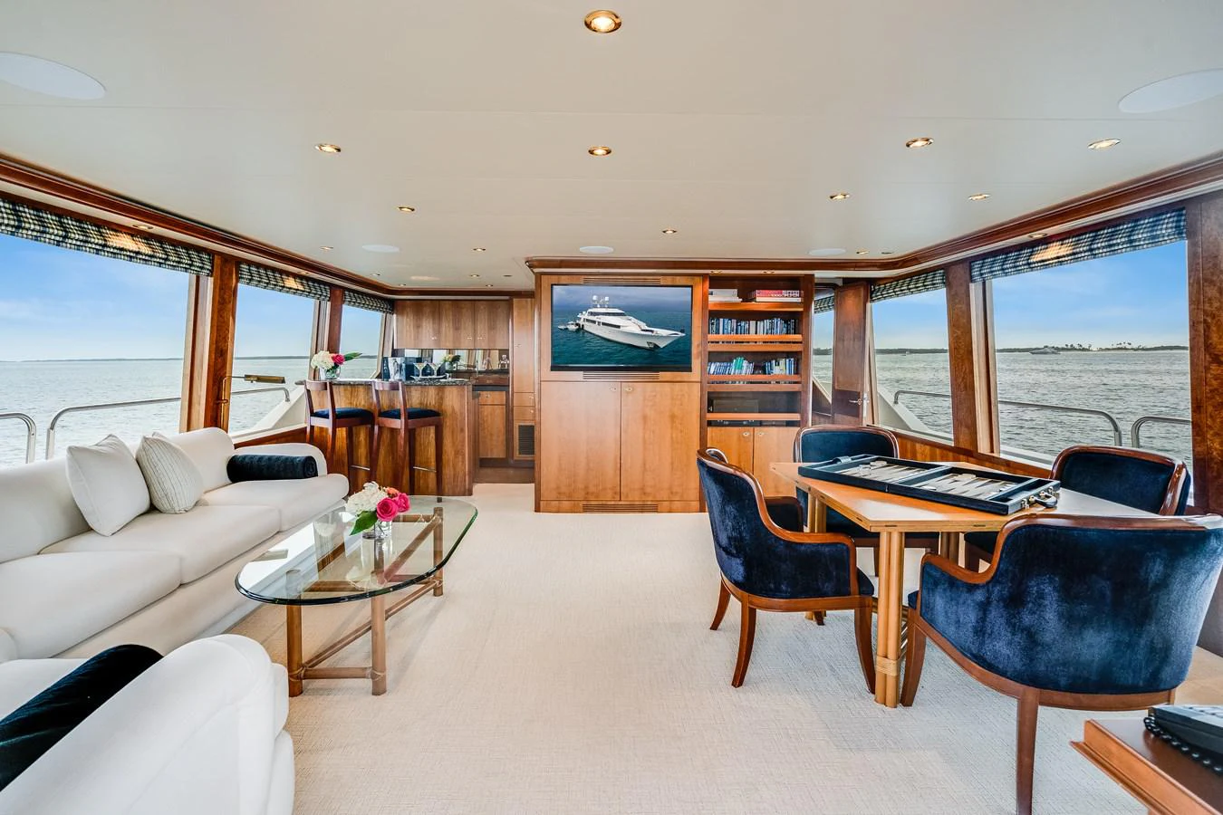 a living room with a large window aboard DONA LOLA Yacht for Sale