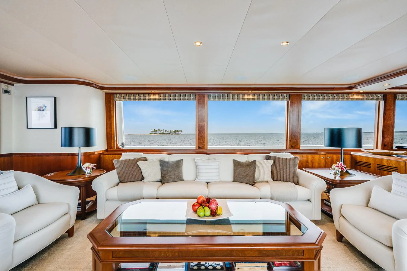 a living room with a large window aboard DONA LOLA Yacht for Sale