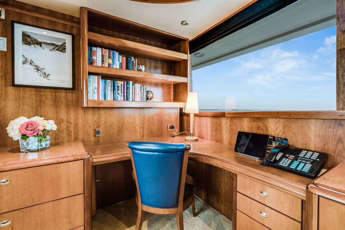 a room with a desk and a tv aboard DONA LOLA Yacht for Sale