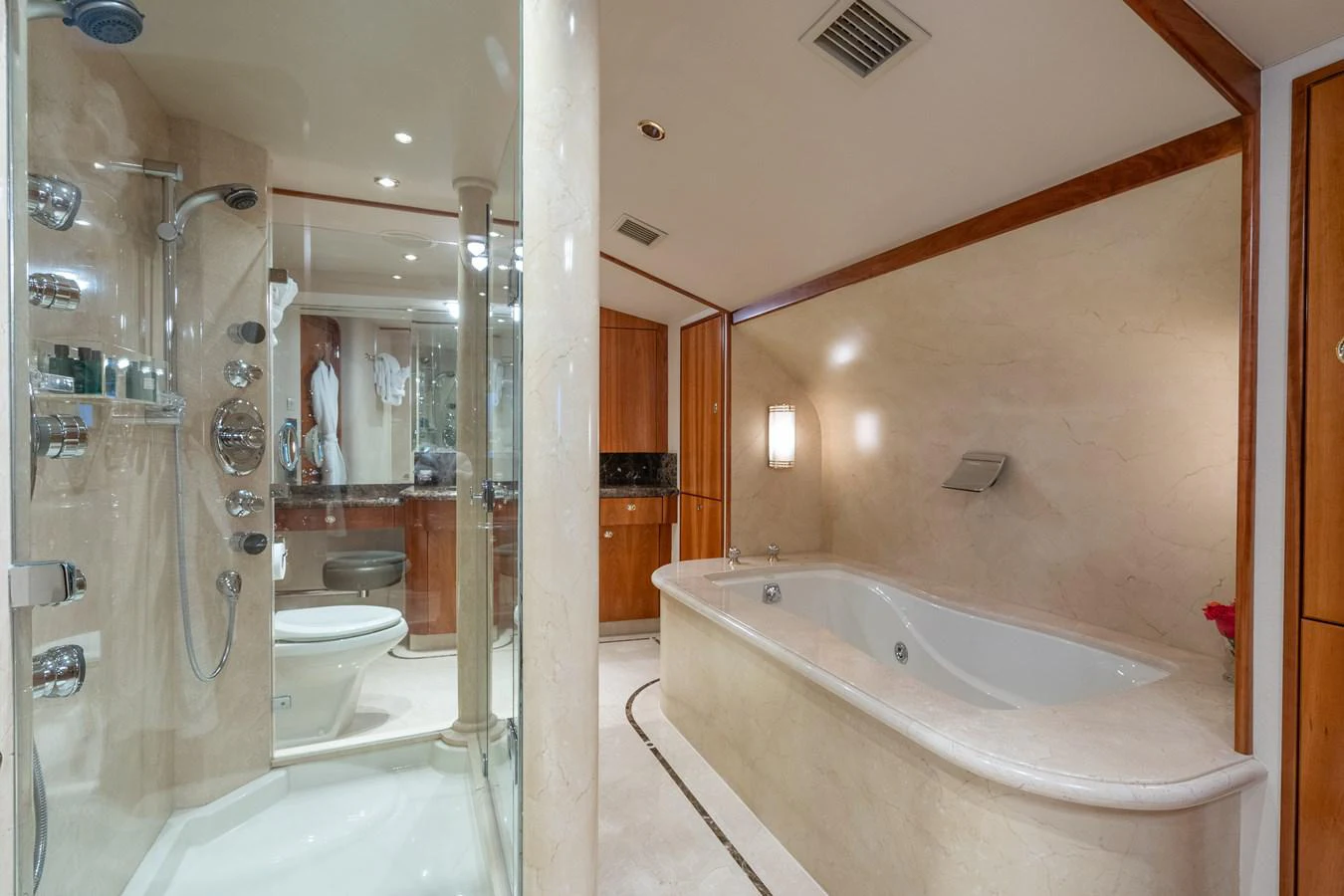 a bathroom with a tub and shower aboard DONA LOLA Yacht for Sale