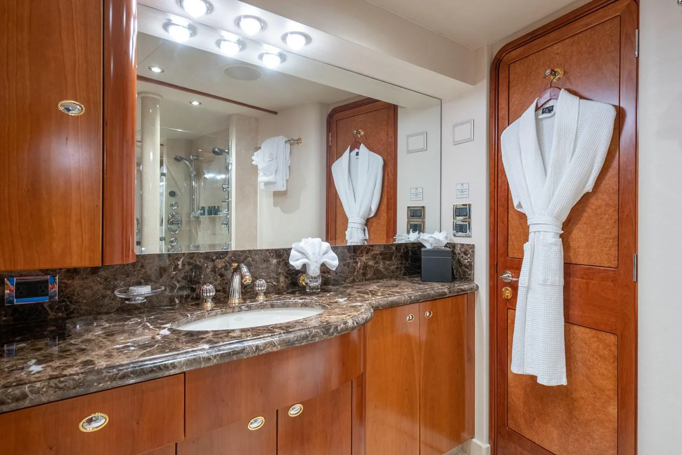 a bathroom with a large mirror aboard DONA LOLA Yacht for Sale