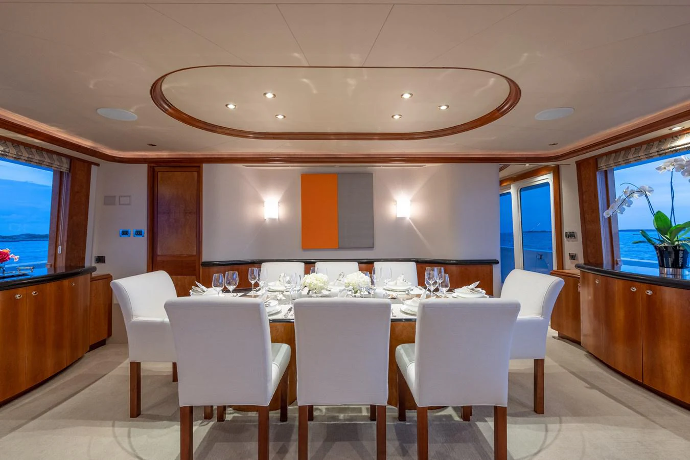 a large room with tables and chairs aboard DONA LOLA Yacht for Sale