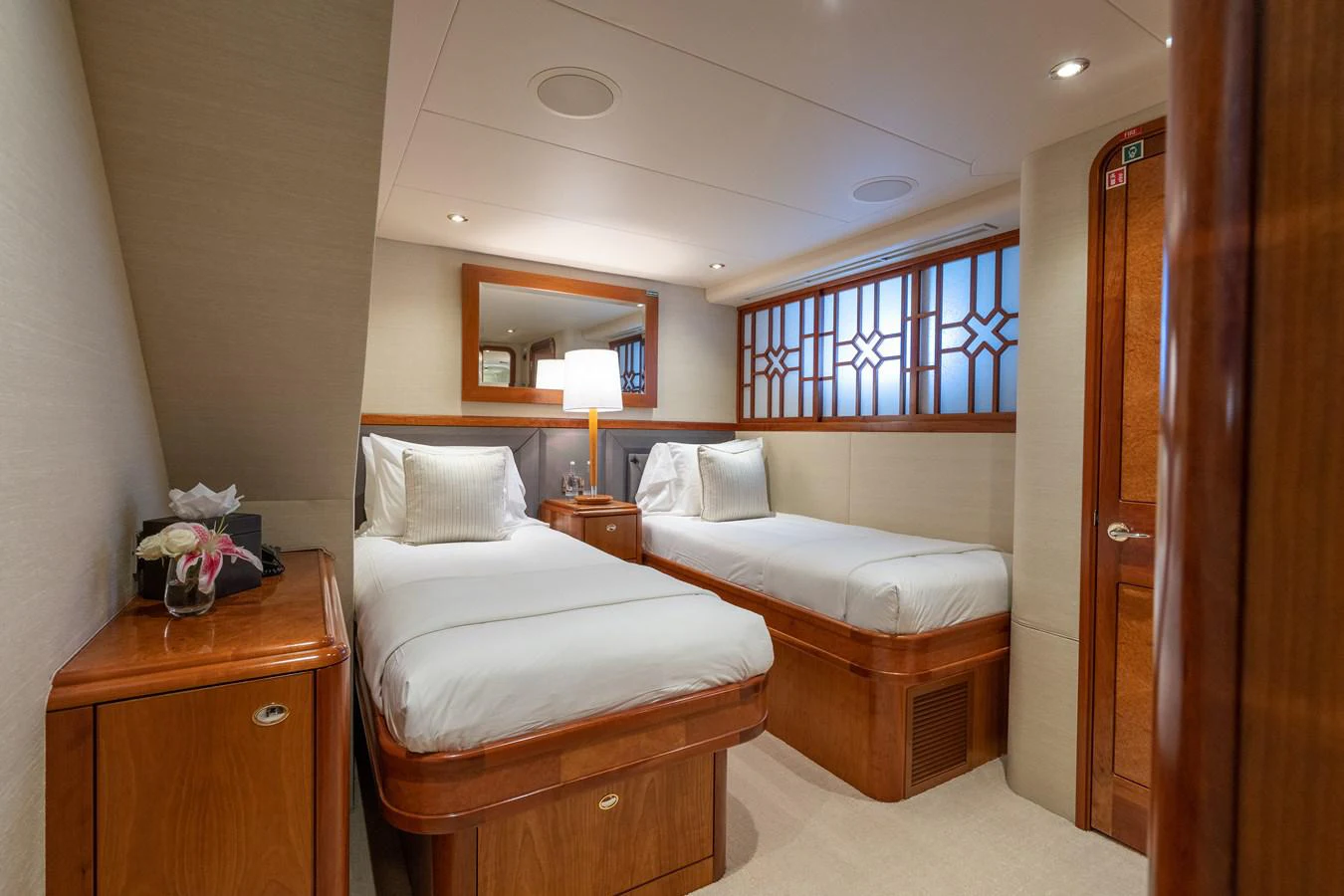 a room with two beds aboard DONA LOLA Yacht for Sale