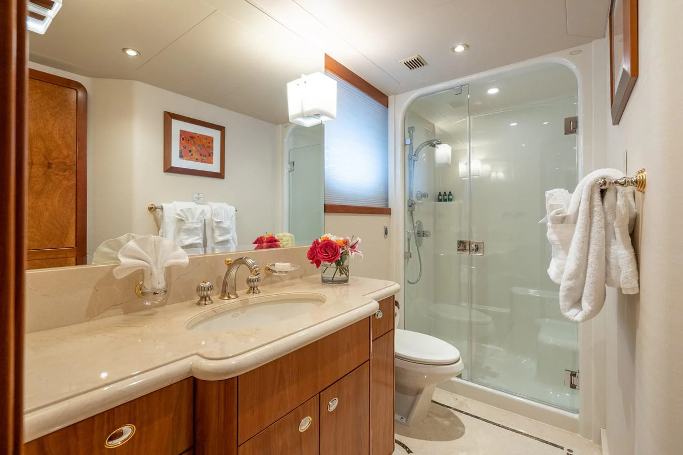 a bathroom with a glass shower aboard DONA LOLA Yacht for Sale