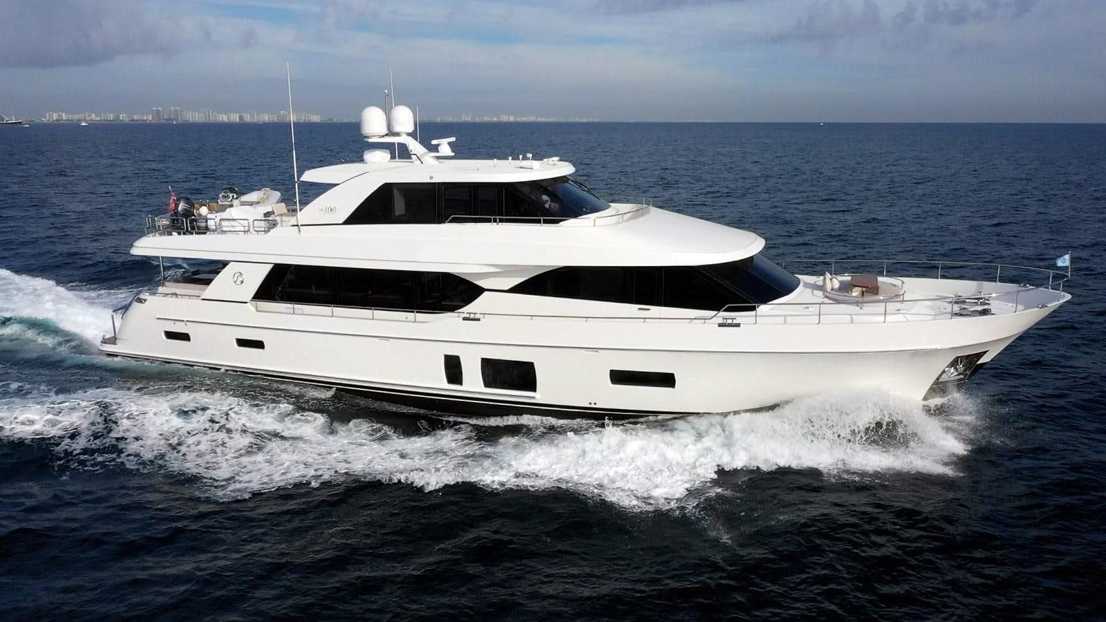 a white yacht on the water aboard SHORT GAME Yacht for Sale