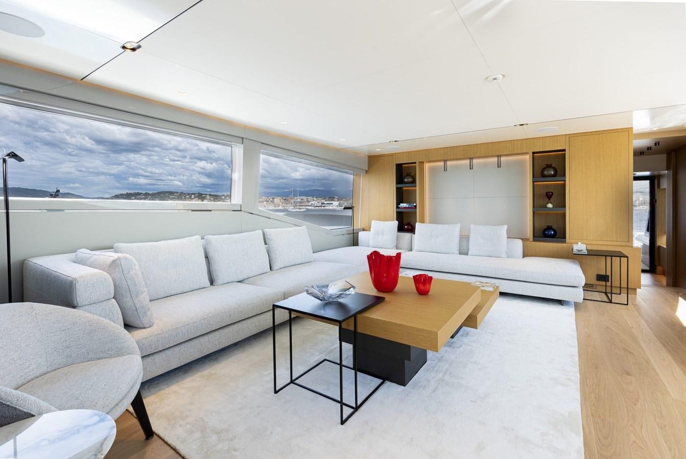 a living room with a couch and a table aboard EXTRA X99 FAST Yacht for Sale