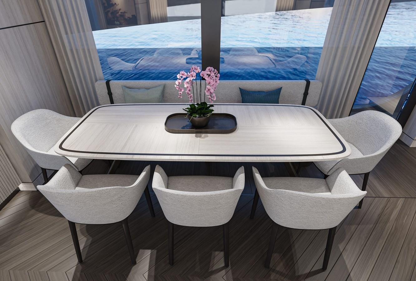 a table with chairs around it aboard EXTRA X98 RPH Yacht for Sale