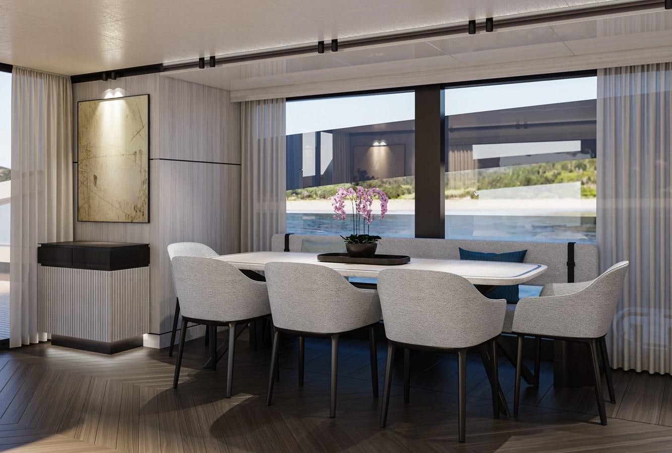 a room with a table and chairs aboard EXTRA X98 RPH Yacht for Sale