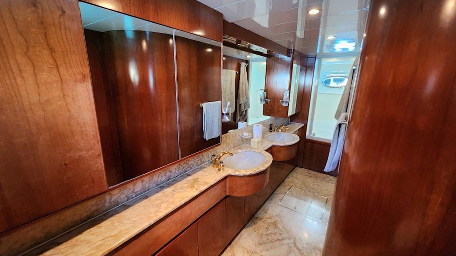 a bathroom with a large mirror aboard THE ONE Yacht for Sale