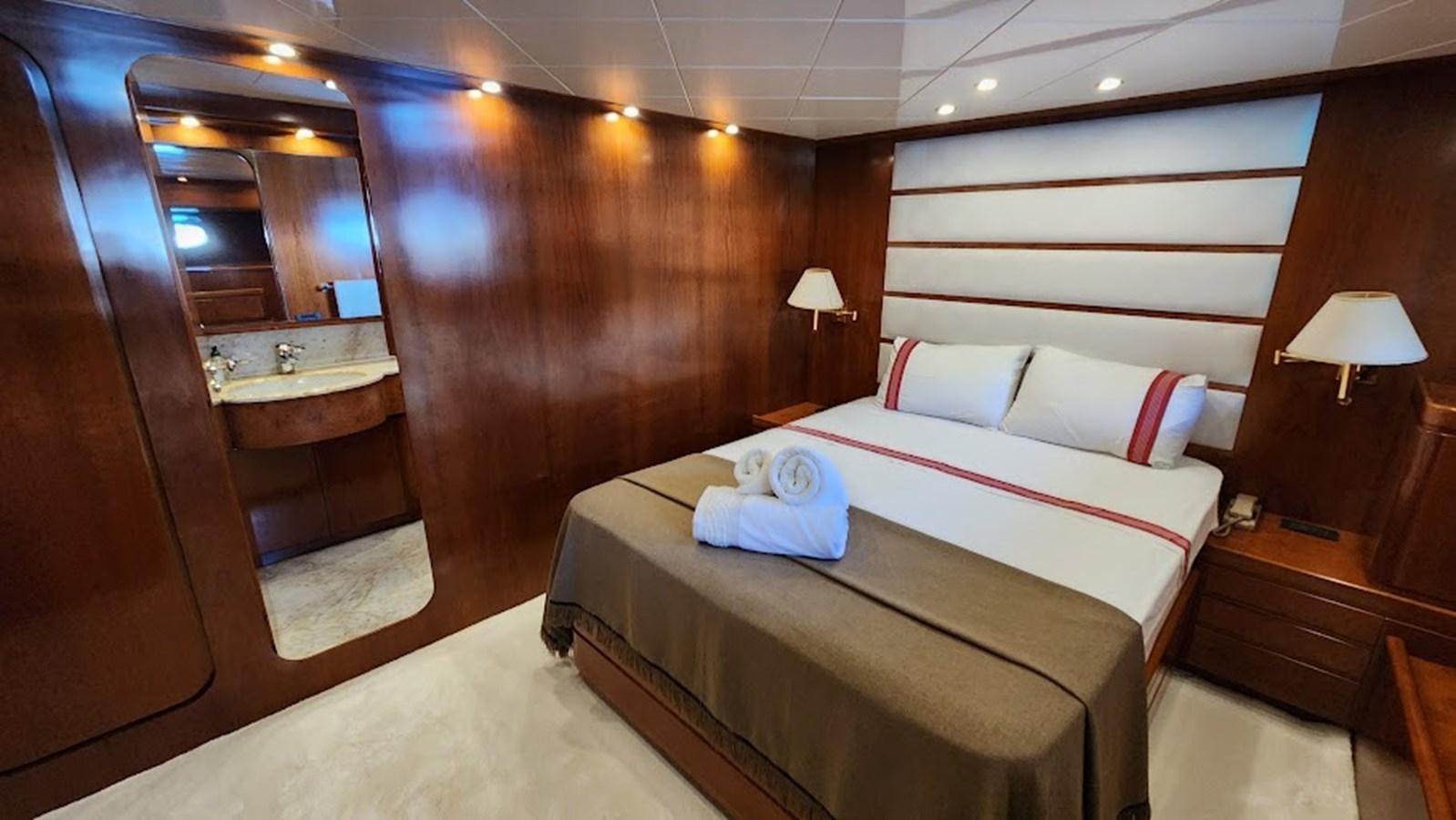 a room with a couple beds aboard THE ONE Yacht for Sale