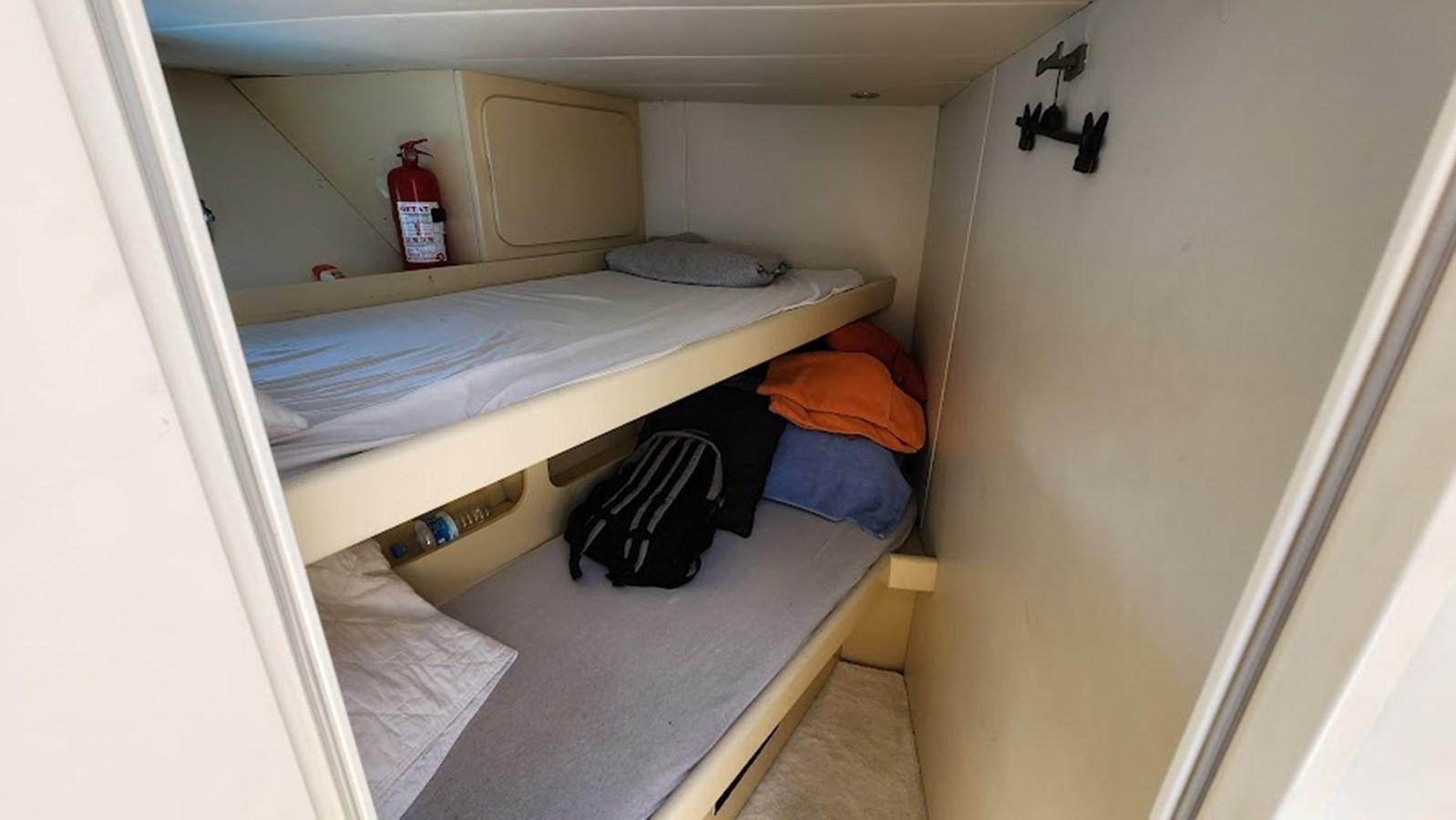 a room with bunk beds aboard THE ONE Yacht for Sale