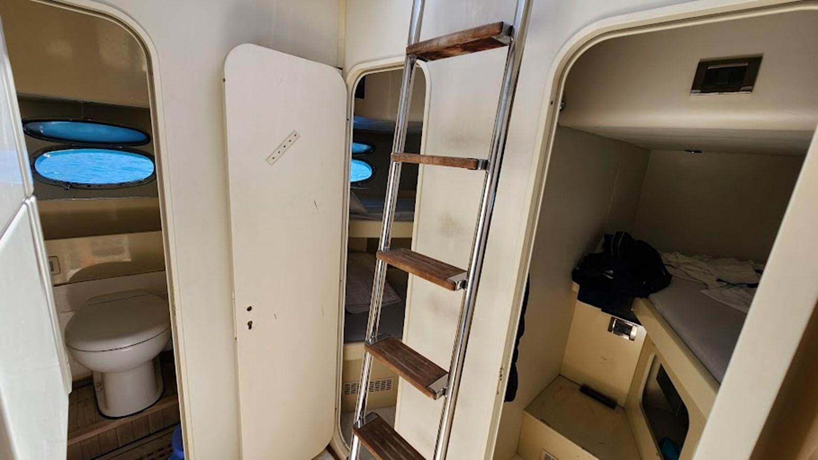 a toilet and a sink in a bathroom aboard THE ONE Yacht for Sale