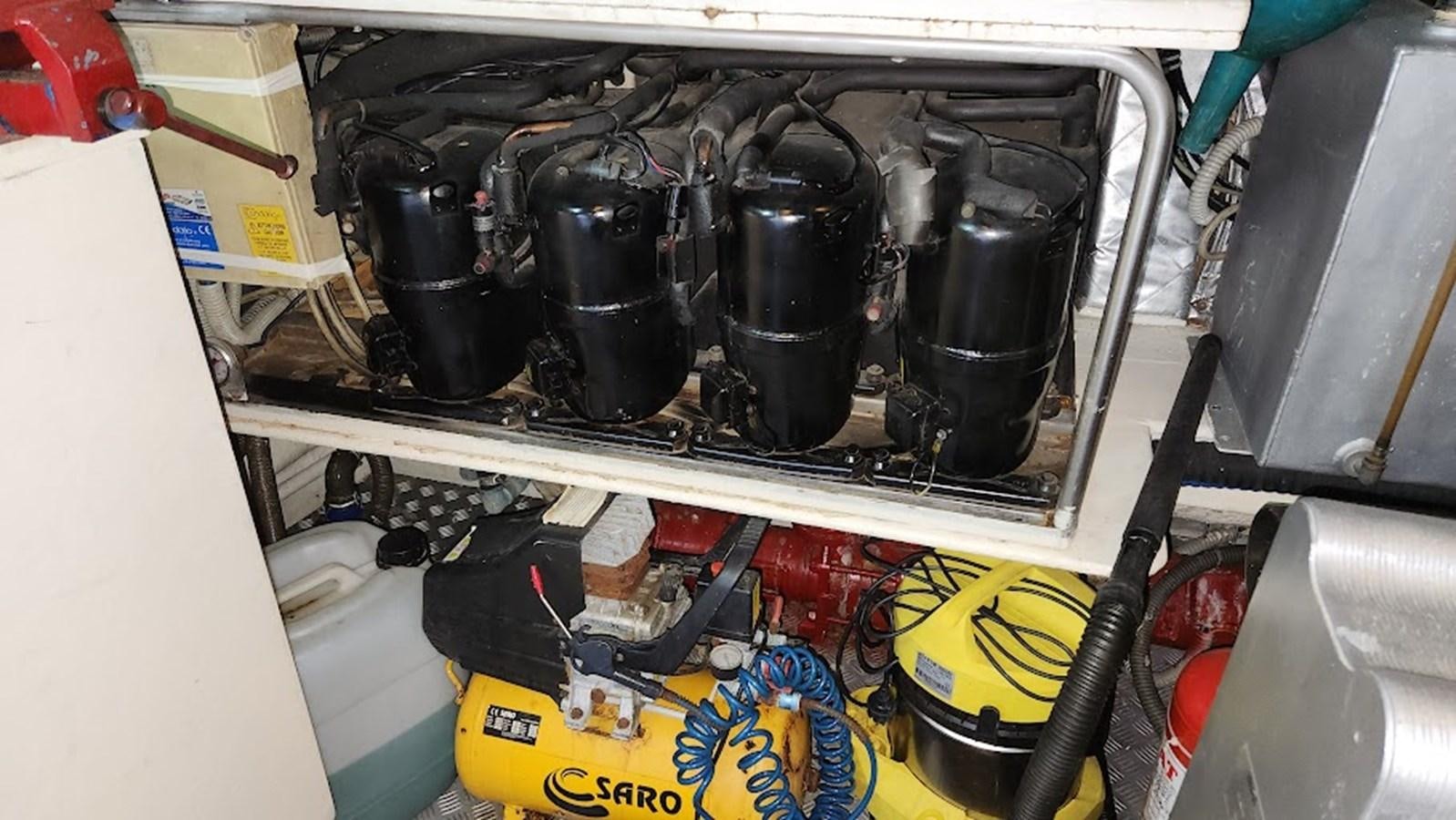 a car engine with a black hood aboard THE ONE Yacht for Sale