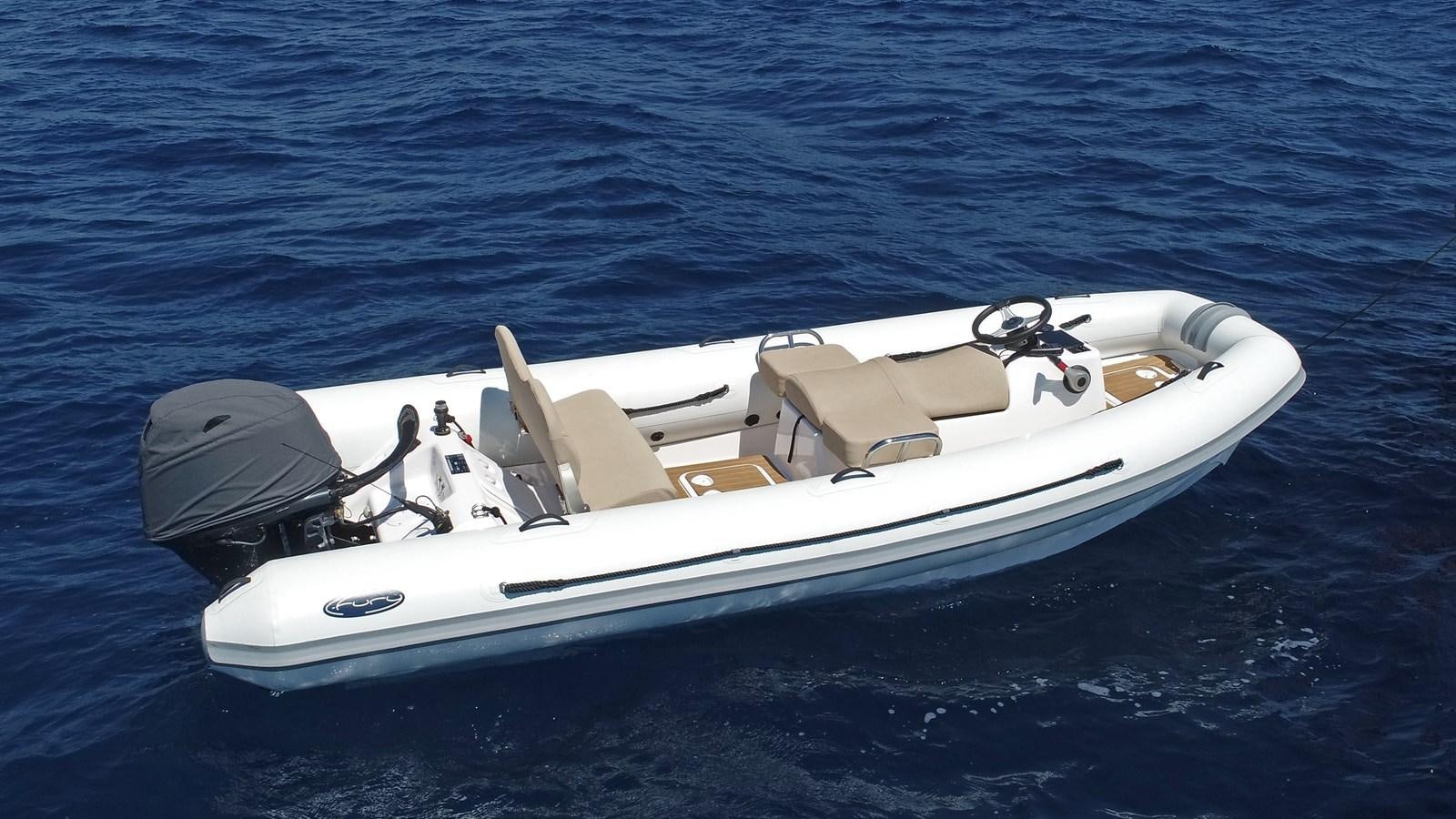 a white boat in the water aboard SOJANA Yacht for Sale