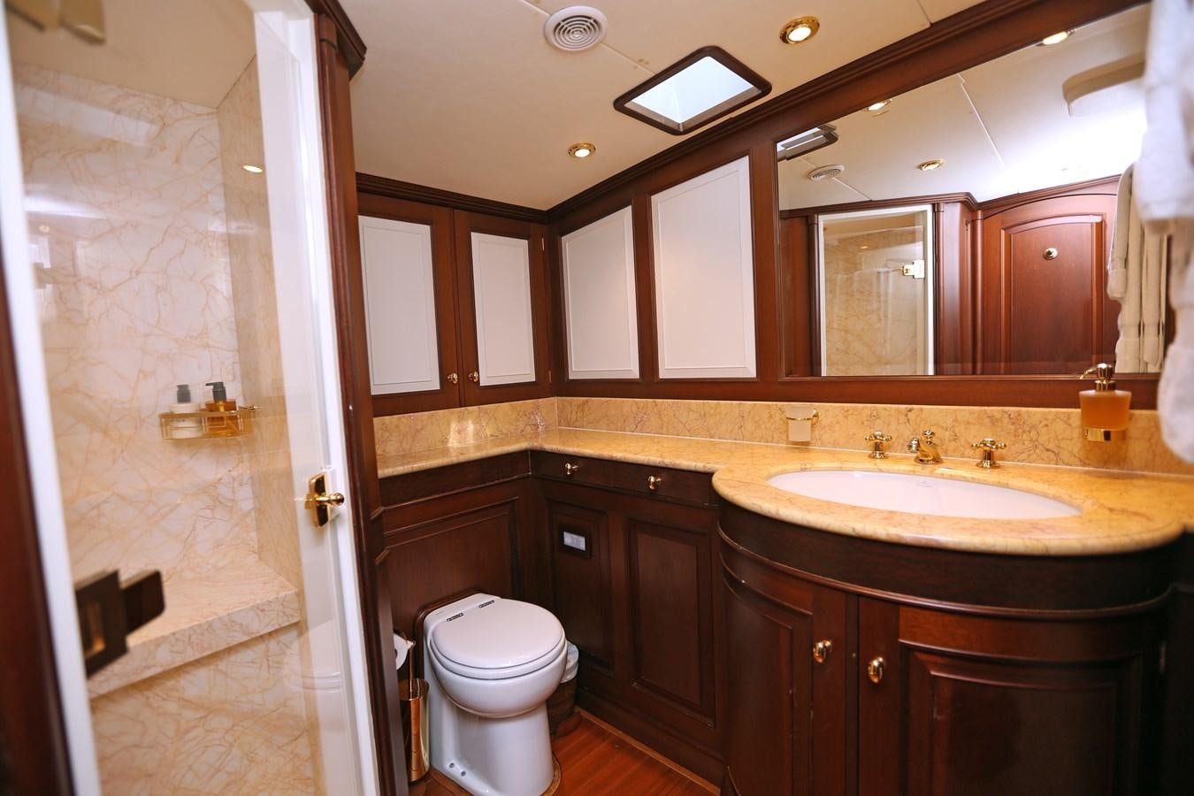 a bathroom with a toilet and a sink aboard SOJANA Yacht for Sale