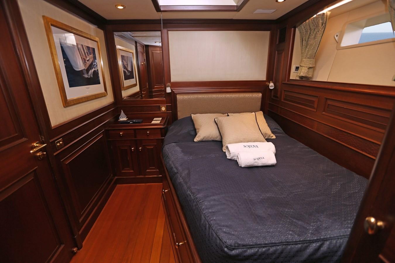 a bed in a room aboard SOJANA Yacht for Sale
