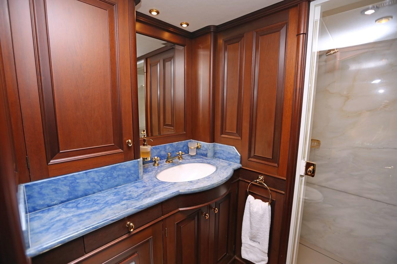 a bathroom with a sink and cabinets aboard SOJANA Yacht for Sale