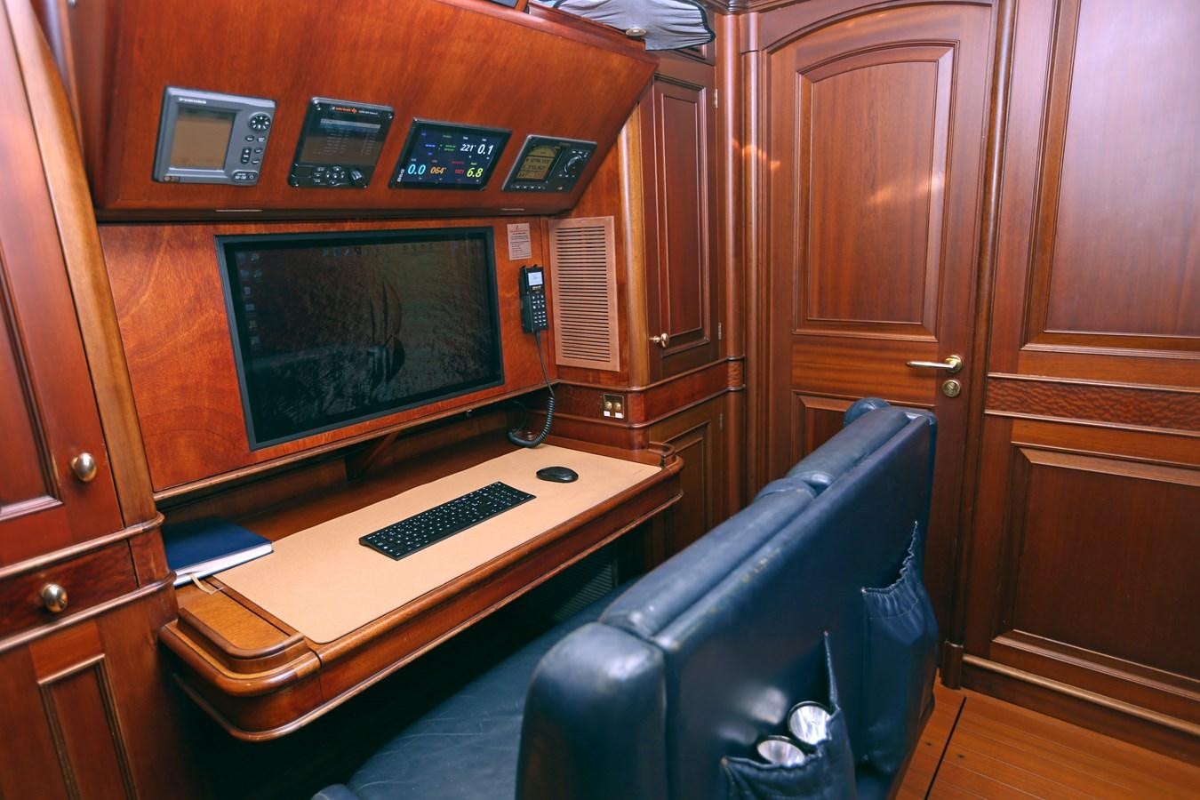a computer desk in a room aboard SOJANA Yacht for Sale