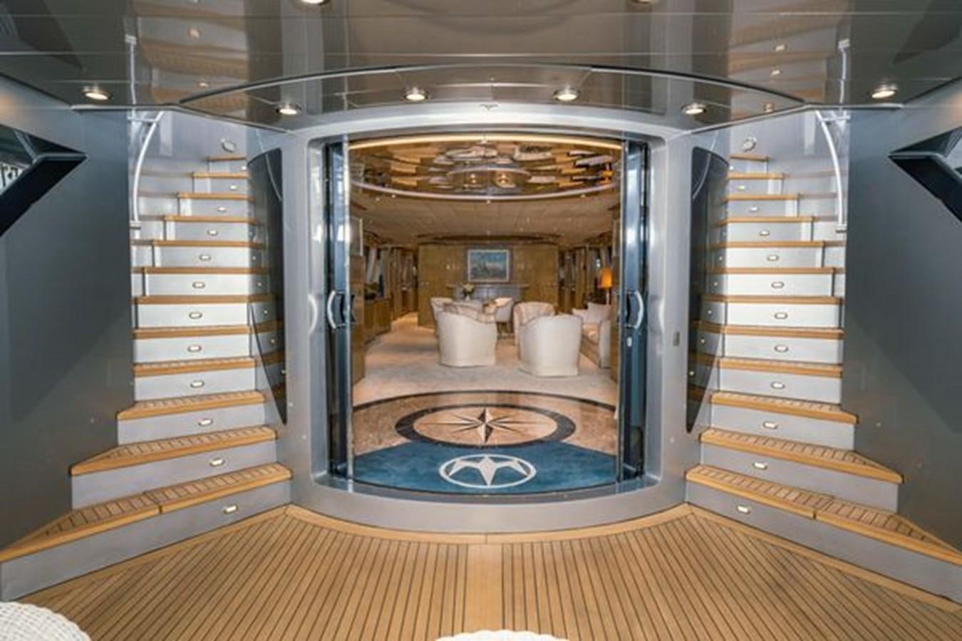 a large glass door with a large mirror on the side aboard 2003 BAGLIETTO 38M FAST FLY Yacht for Sale