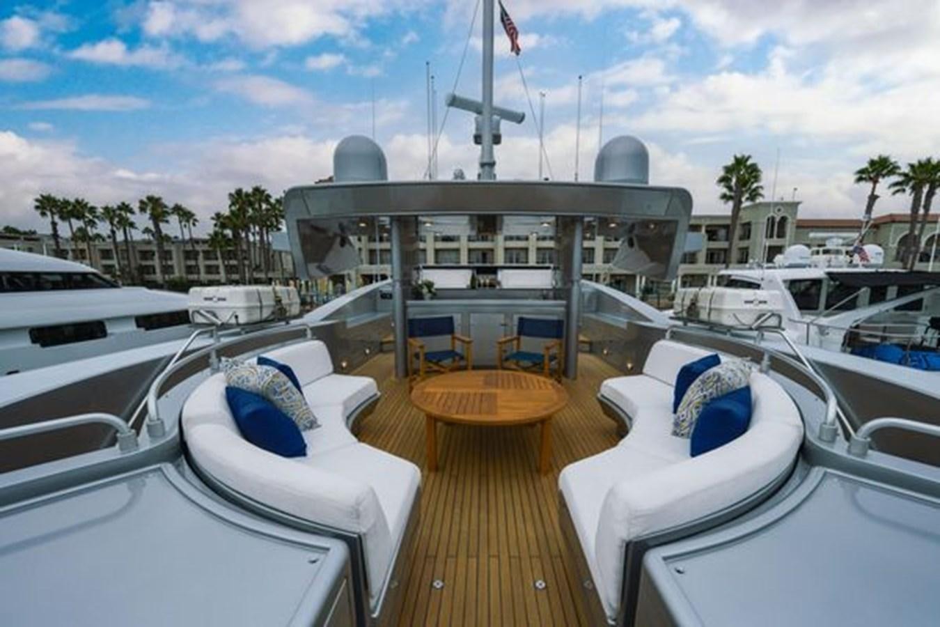 a deck with a deck and chairs aboard 2003 BAGLIETTO 38M FAST FLY Yacht for Sale