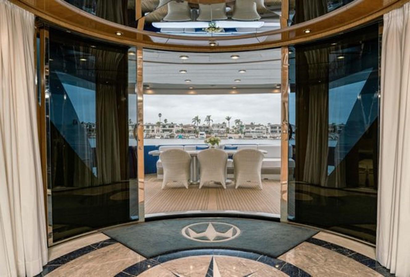 a room with a table and chairs aboard 2003 BAGLIETTO 38M FAST FLY Yacht for Sale