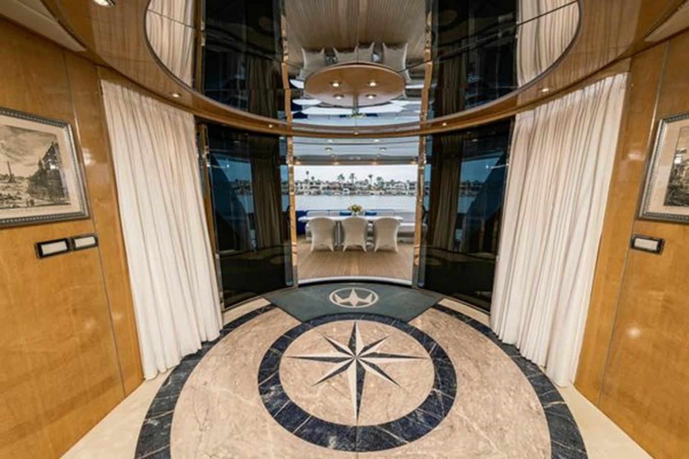 a room with a table and chairs aboard 2003 BAGLIETTO 38M FAST FLY Yacht for Sale
