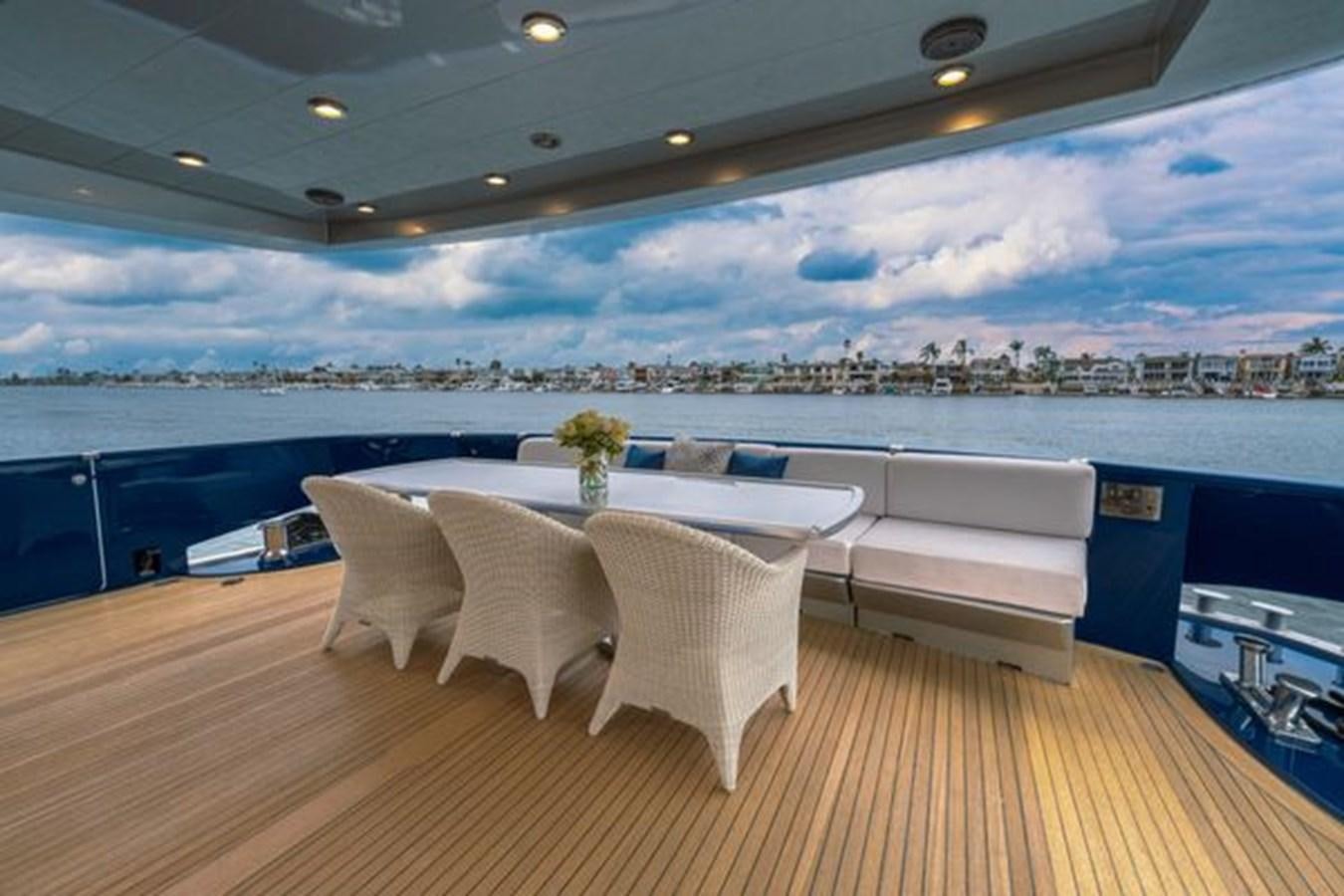 a room with a table and chairs aboard 2003 BAGLIETTO 38M FAST FLY Yacht for Sale