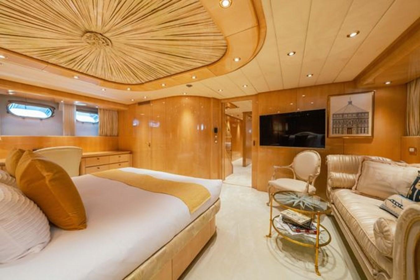 a room with a bed and a couch aboard 2003 BAGLIETTO 38M FAST FLY Yacht for Sale