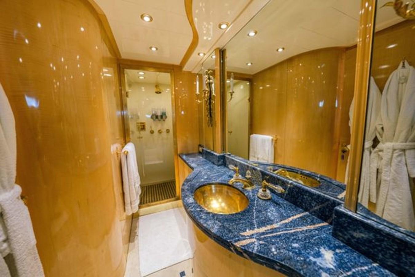 a bathroom with a large marble sink aboard 2003 BAGLIETTO 38M FAST FLY Yacht for Sale