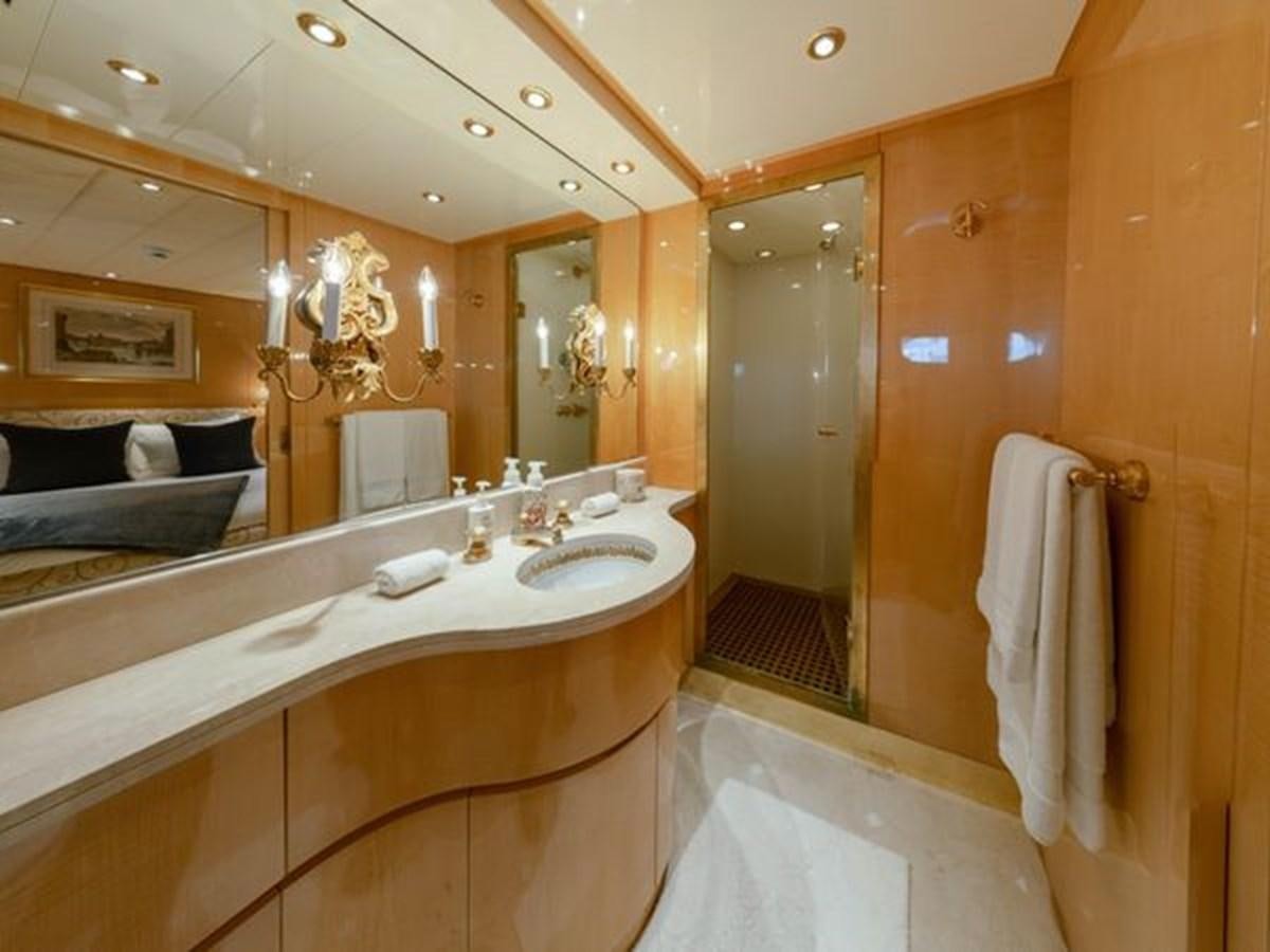 a bathroom with a large mirror aboard 2003 BAGLIETTO 38M FAST FLY Yacht for Sale