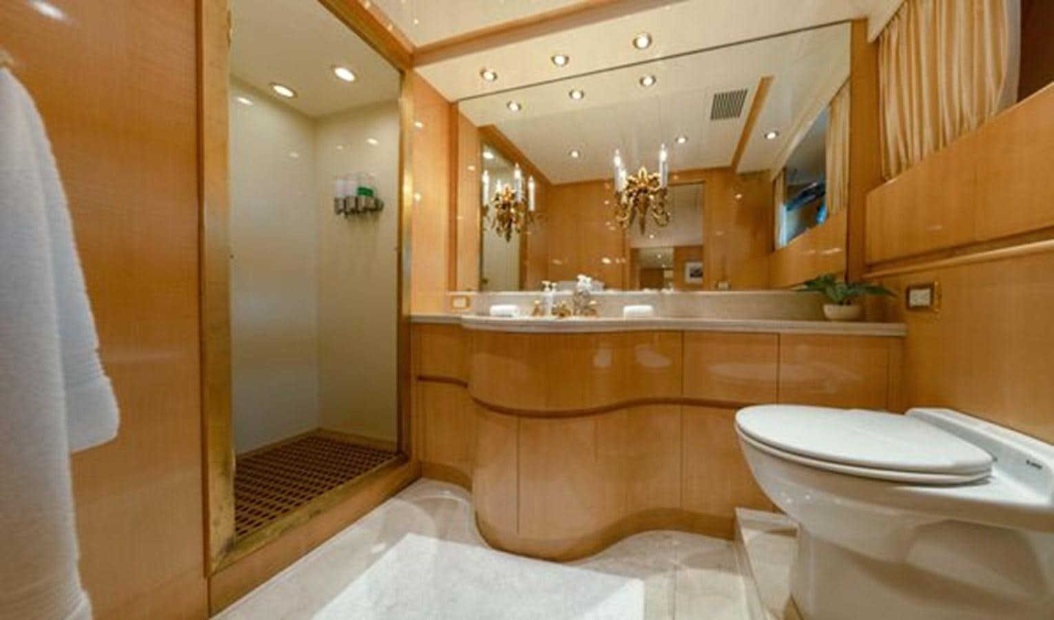 a bathroom with a large mirror aboard 2003 BAGLIETTO 38M FAST FLY Yacht for Sale