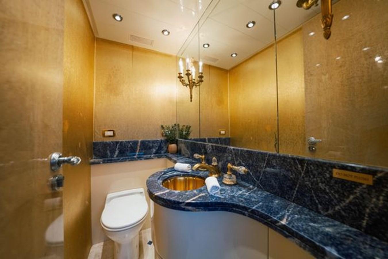 a bathroom with a tub sink and toilet aboard 2003 BAGLIETTO 38M FAST FLY Yacht for Sale