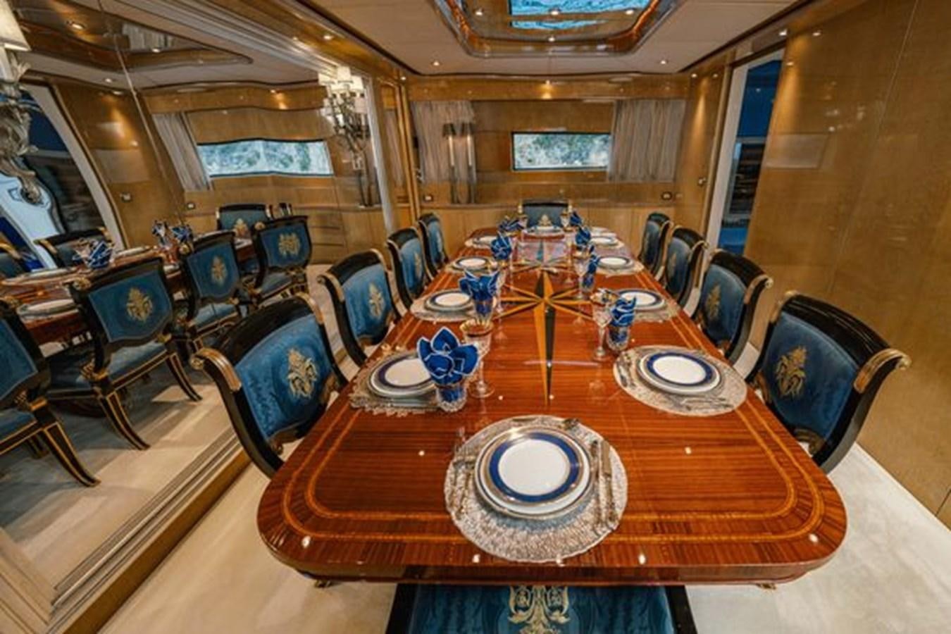 a large dining room with a large table and chairs aboard 2003 BAGLIETTO 38M FAST FLY Yacht for Sale